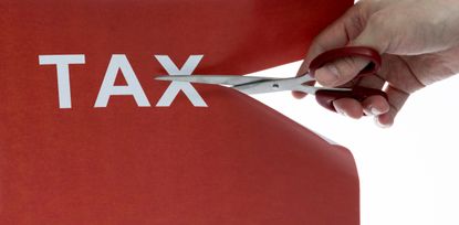 Cutting off the word tax with scissors