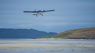 Plane coming in to land on Barra Island