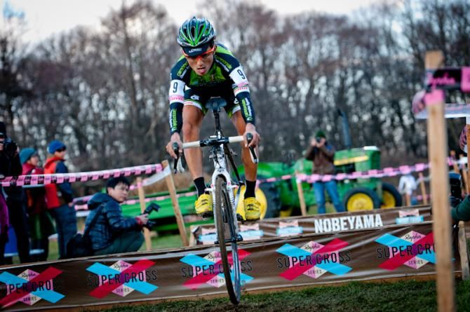 Kazuhiro Yamamoto (Cannondale - Championsystem) jumped over the barriers