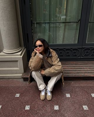 Aimee Song wearing a pair Miu Miu sneakers that tap into the '70s sneaker trend.