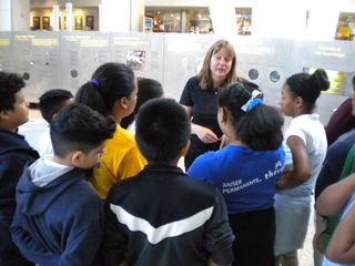 Cathy Olkin, deputy project scientist for New Horizons, speaks with students during the "Pluto-Palooza" event at the American Museum of Natural History in New York.