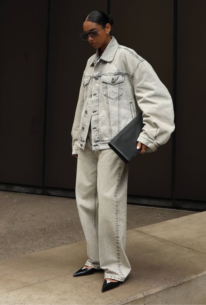 @cherifaakili wears a denim co-ord, black pointed flats and a clutch bag