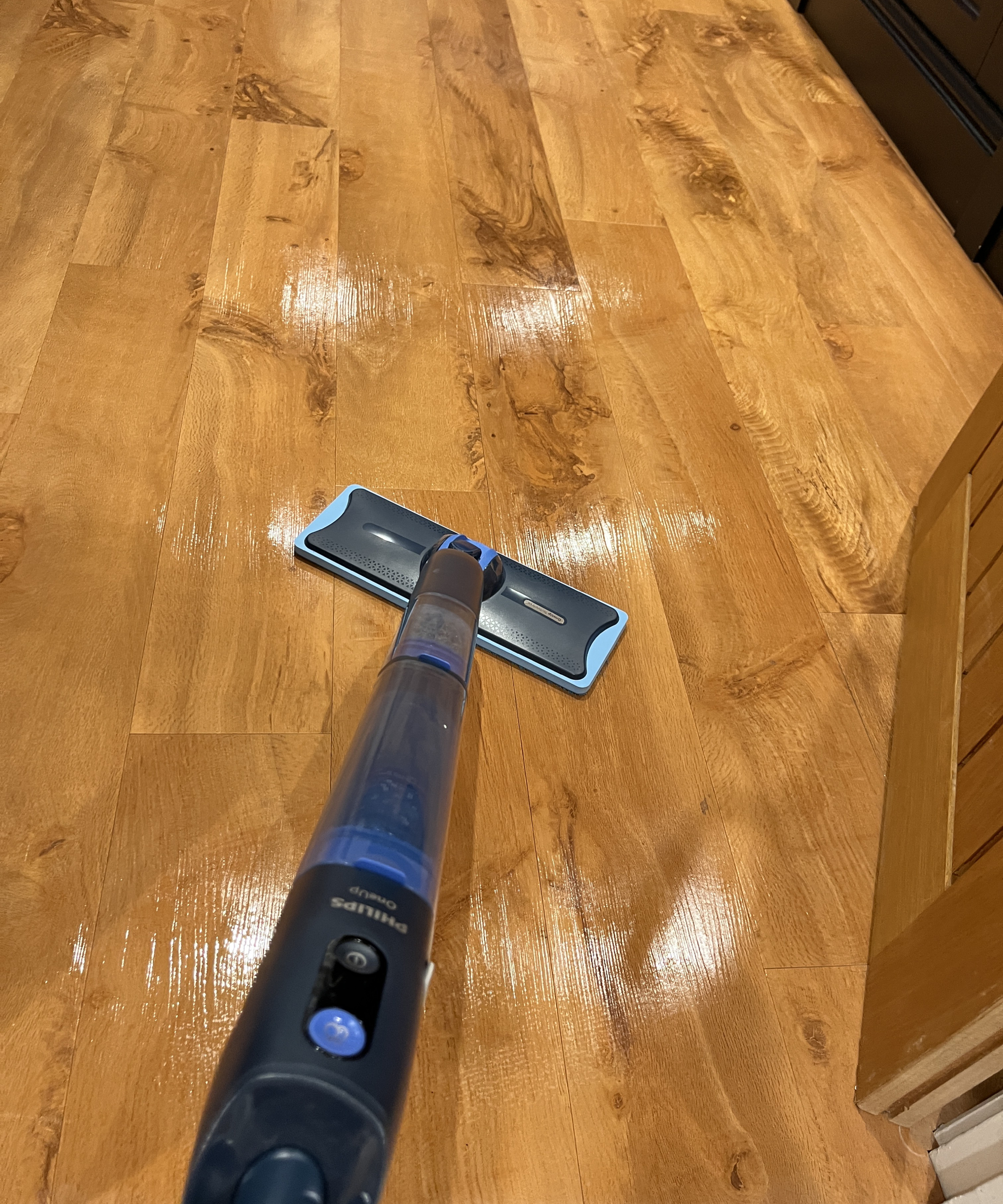 Philips OneUP 5000 series electric mop being used on wooden floor