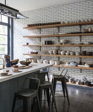 modern kitchen with metro tiles and wooden shelves