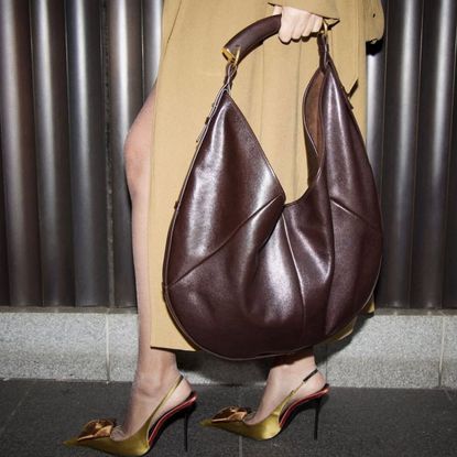 hannah strafford taylor carries a saint laurent mombasa leather bag