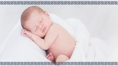 Sleeping baby wrapped in towel