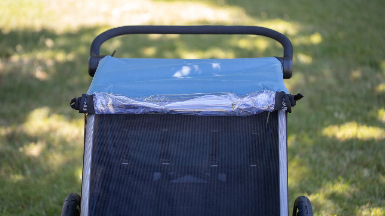 Thule Courier detail showing rain cover rolled up.