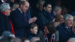 Prince William, Duke of Cambridge, Prince George of Cambridge and Catherine, Duchess of Cambridge attend the Six Nations international rugby union match