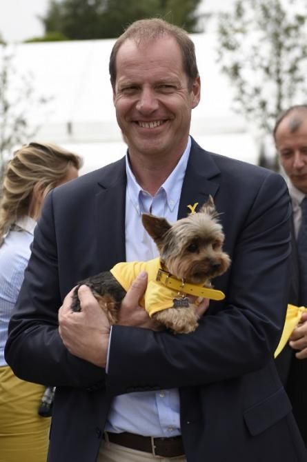Christian Prudhomme gets his own yorkie for the Tour de France Grand Depart ribbon cutting