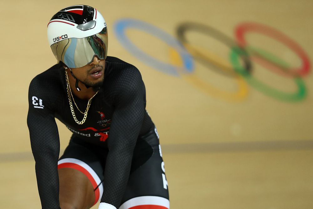 Njisane Phillip (L) of Trinidad and Tobago reacts after his defeat to Chao Xu of China in the Men's Sprint