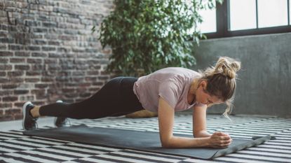 A woman performing a plank