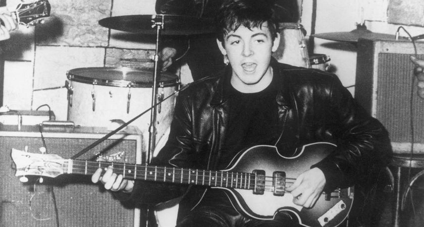 An early picture of Paul McCartney returning to the Beatles&#039; base camp at the Cavern, Liverpool. He plays his Höfner 500/1 bass guitar.