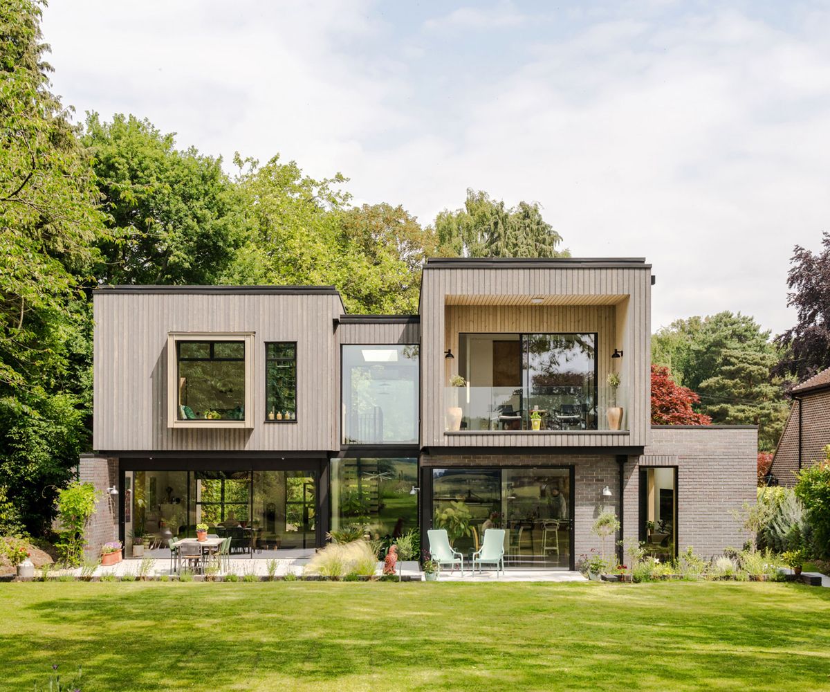Rear exterior of a contemporary self build home with bold geometric forms