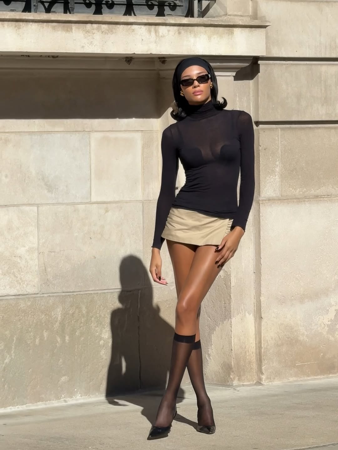 woman wearing chic holiday outfit idea 2025