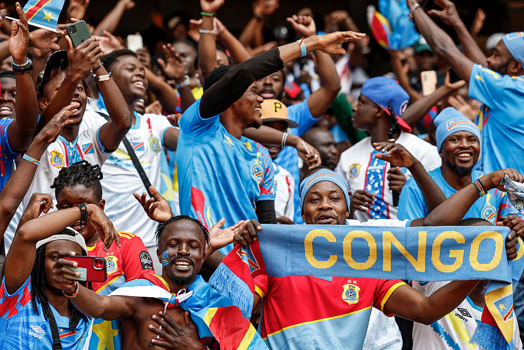 Supporters of the Democratic Republic of Congo cheer in the stands ahead of the African Nations Championship (CHAN) group stage football match between Kenya and Democratic Republic of Congo at Kasarani Stadium in Nairobi, on August 3, 2025. (Photo by SIMON MAINA / AFP)
