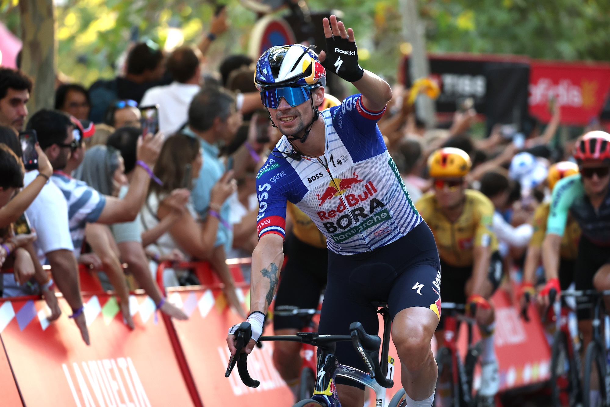 Primoz Roglic waves to the crowds on stage 21 at the Vuelta