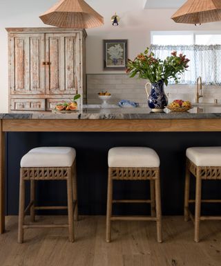 Vintage wooden kitchen with antique pass-through cupboard and rattan accessories