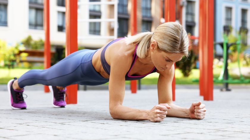 a photo of a woman doing an elbow plank 