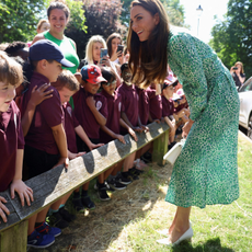Britain's Catherine, Princess of Wales meets with children as she arrives outside the Riversley Park Children's health centre in Nuneaton, on June 15, 2023.