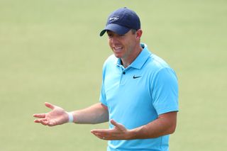Rory McIlroy shrugs his shoulders and holds his hands up in a quizzical manner