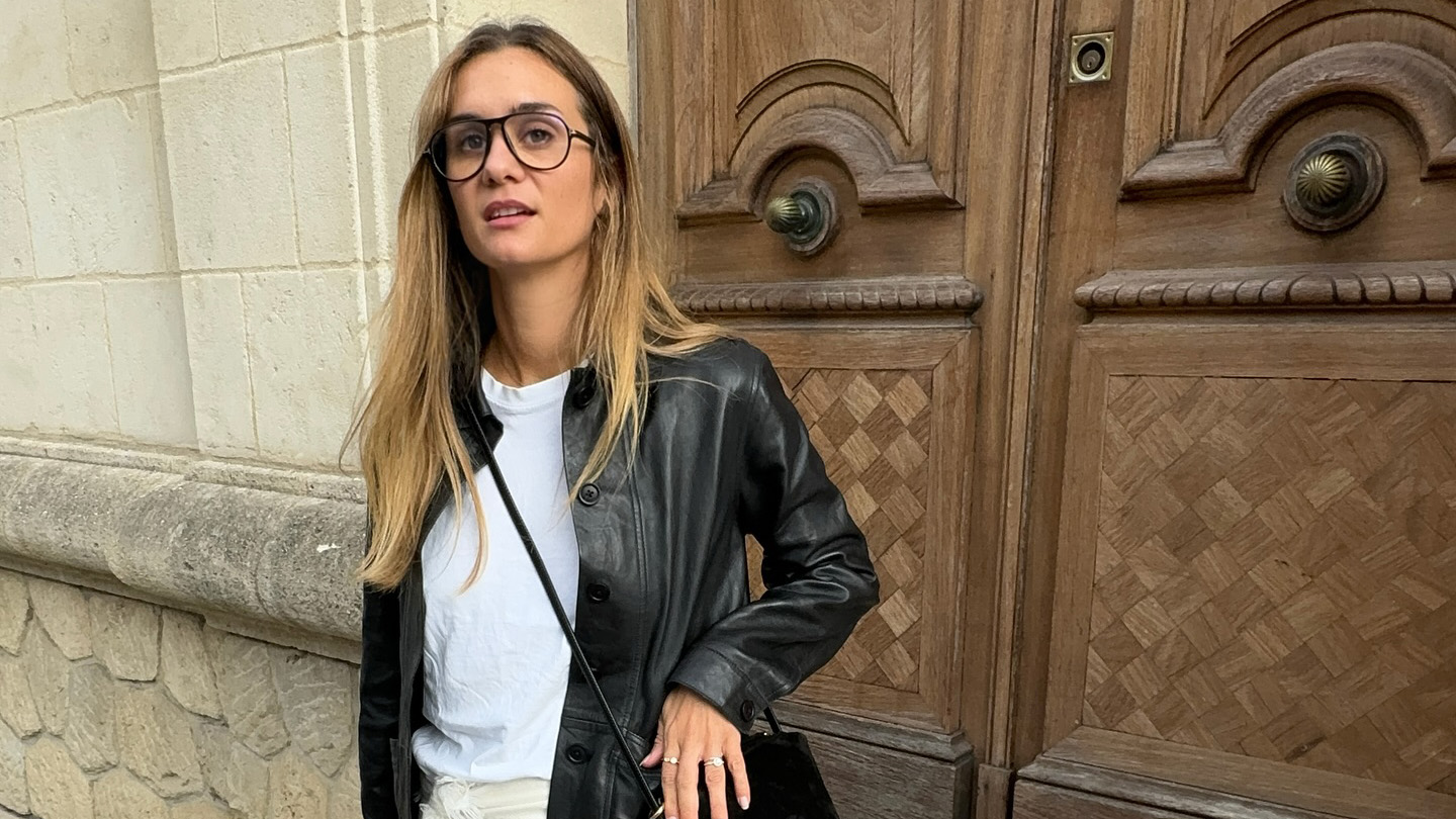 French influencer wearing a leather jacket and miniskirt
