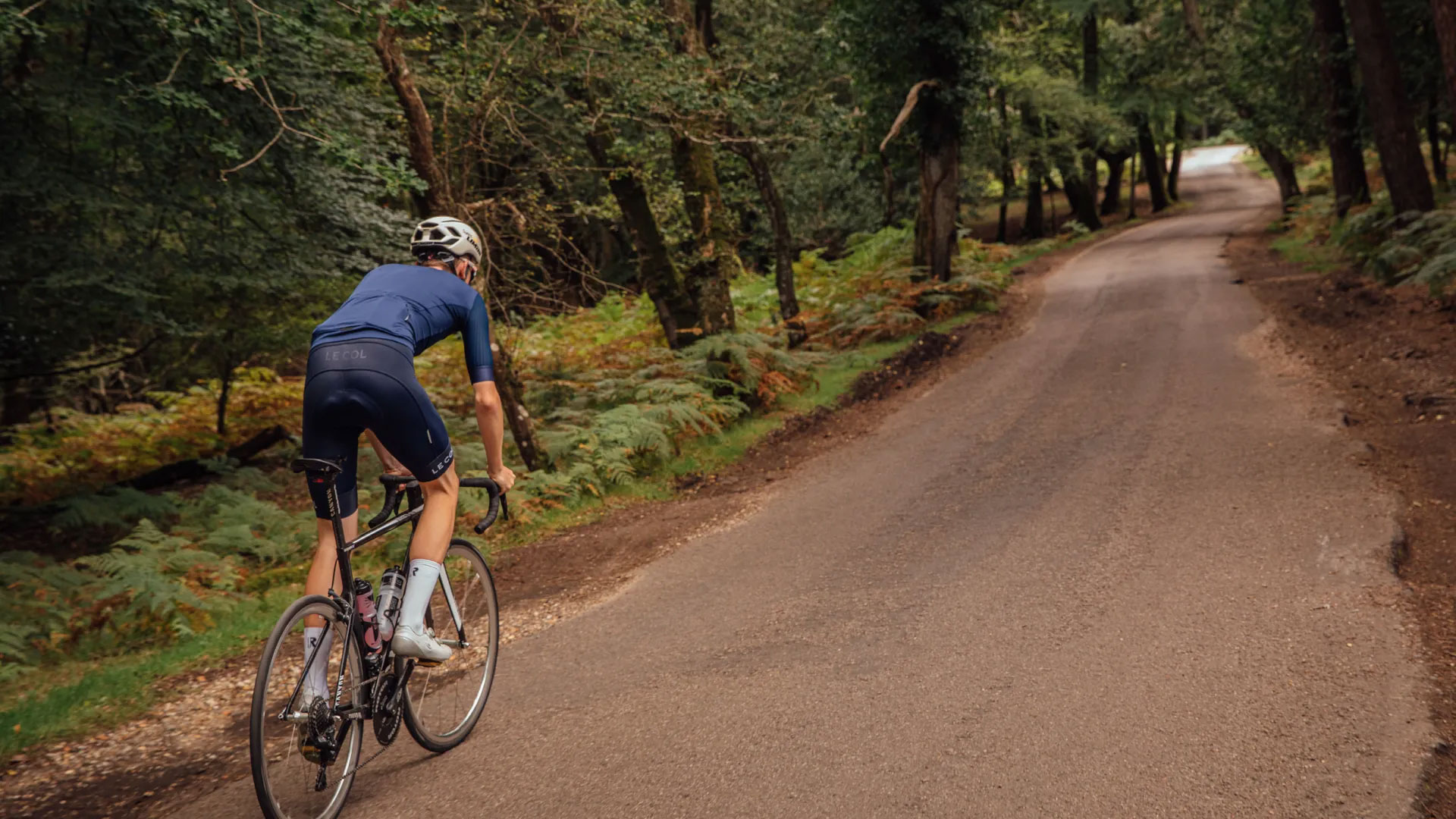 Male cyclist riding out of the saddle