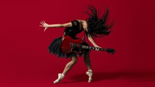 Ballet dancer with an SG-style guitar