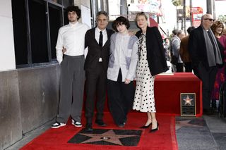 Mark Ruffalo poses with his family on the Hollywood Walk of Fame.