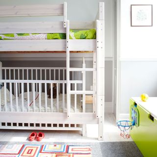 kids room with bunk bed and two rugs