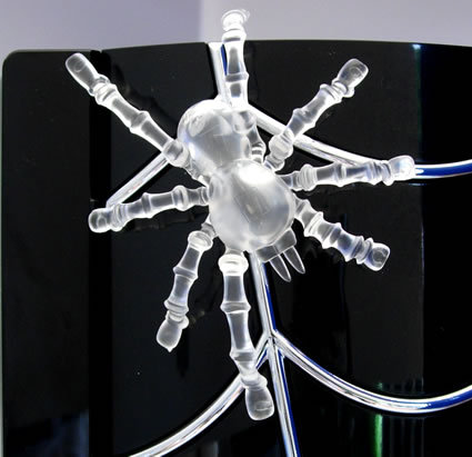 The Black Widow has an internal thermal sensor which activates an LED light that is underneath the translucent spider. At boot time the spider turns blue. When the internal system temperature goes 100 degrees Fahrenheit or higher the spider turns red.