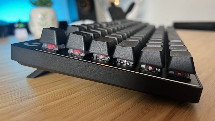 Side view of Logitech G Pro X TKL Rapid gaming keyboard on a wooden desk