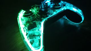 The BigBig Won Rainbow controller on a table glowing