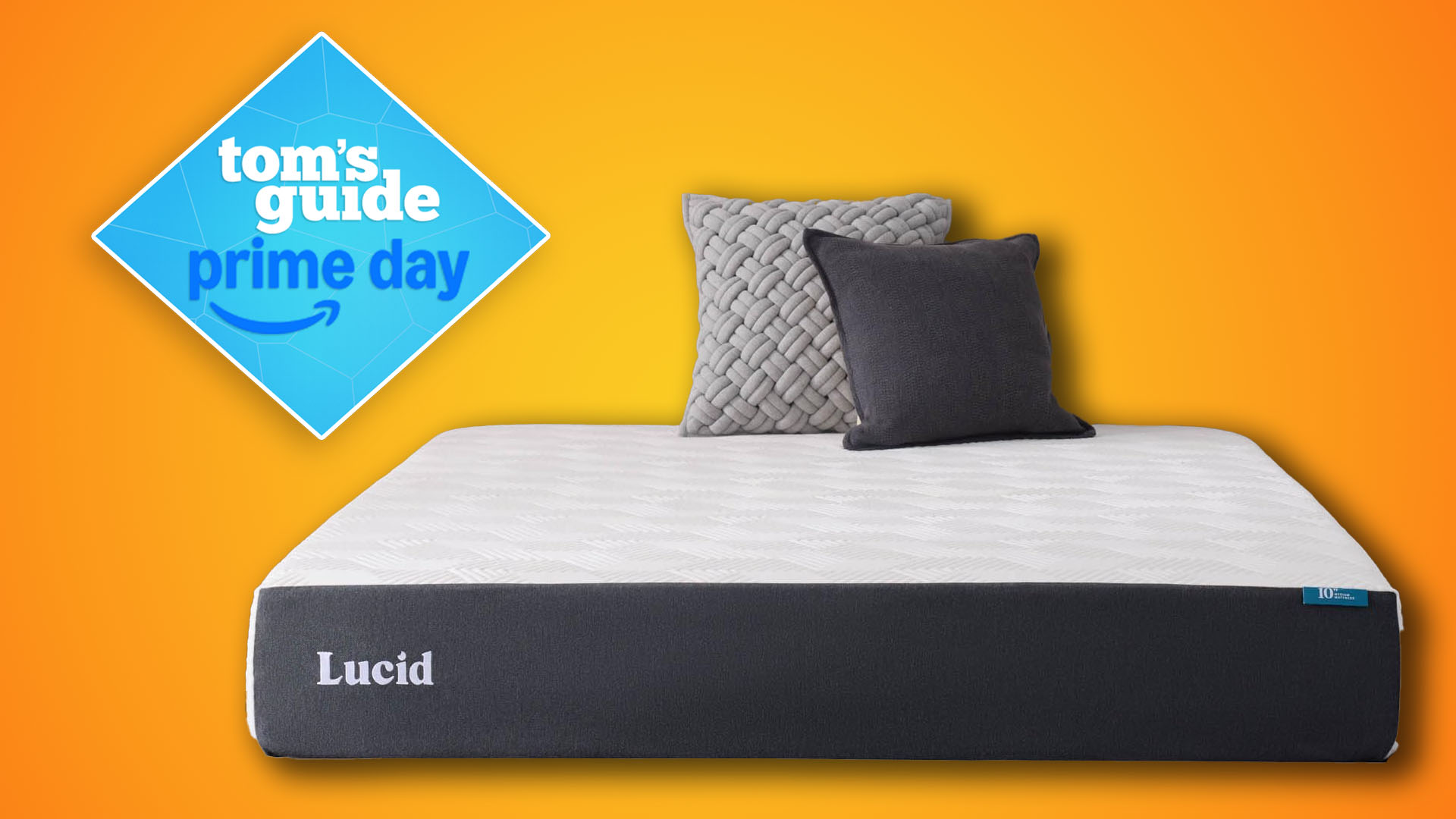 The Lucid Memory Foam Mattress with two cushions at the had of the bed, a Tom&#039;s Guide Prime Day deals graphic in the top left corner, against an orange background