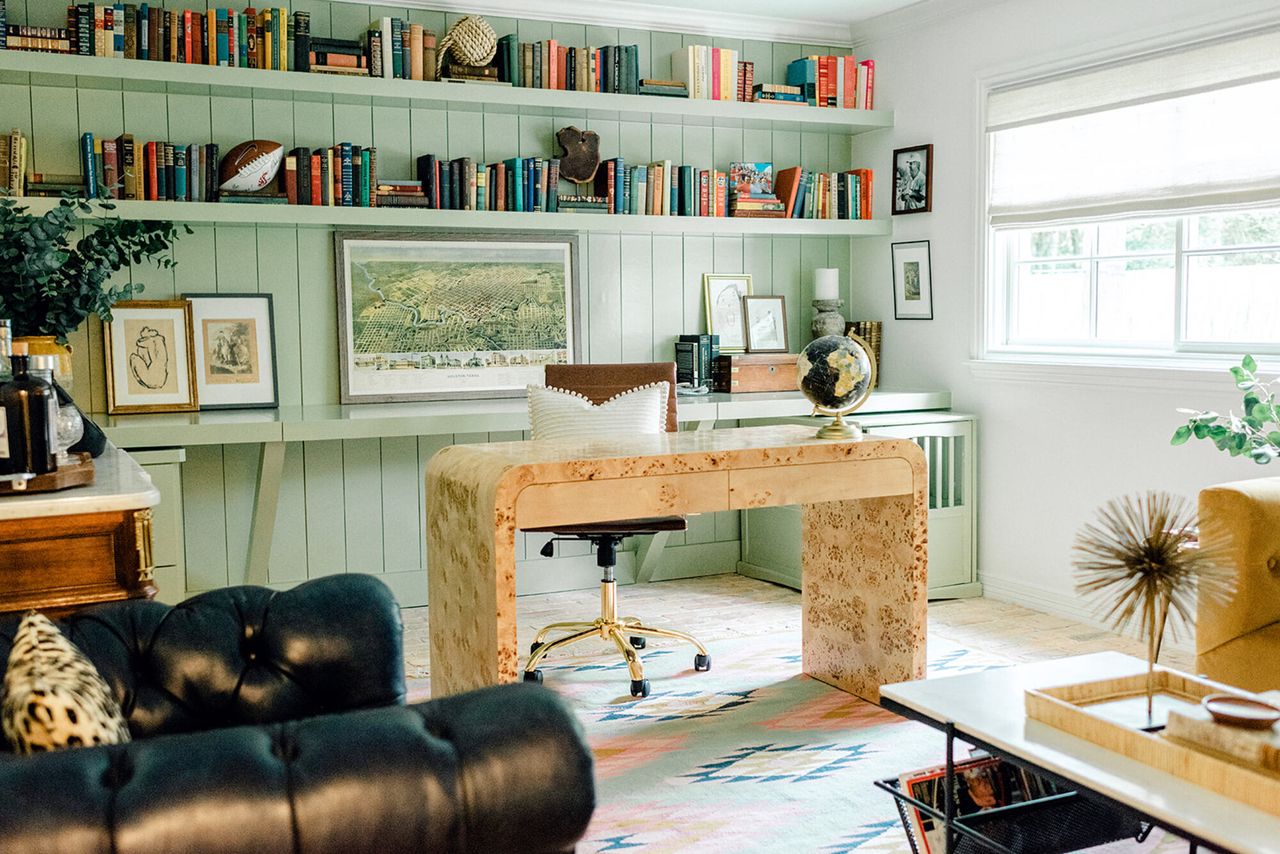 A light green study with books on display