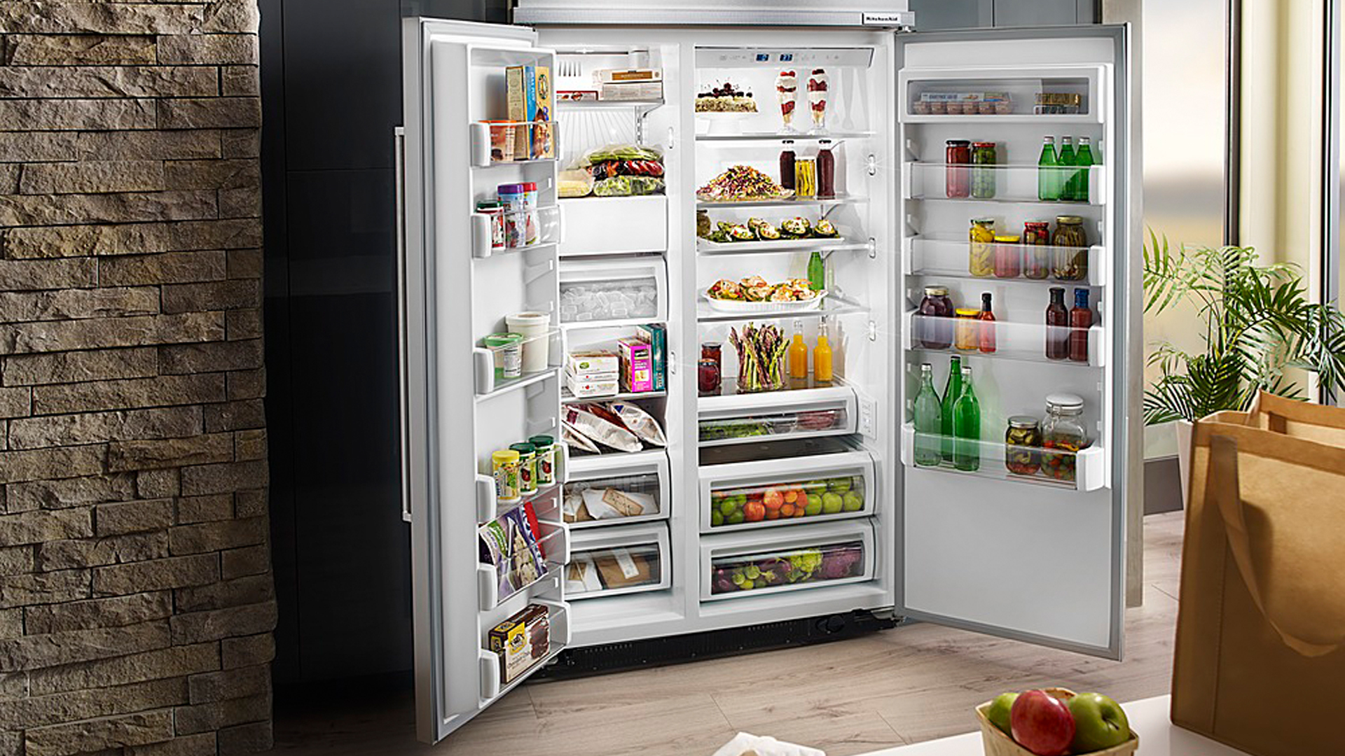KitchenAid KBSD608ESS review: image of open refrigerator within a home