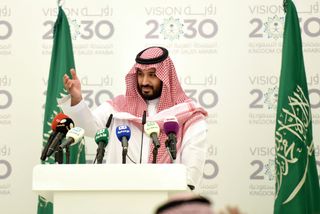 Saudi Defense Minister and Deputy Crown Prince Mohammed bin Salman gestures during a press conference in Riyadh, on April 25, 2016. The key figure behind the unveiling of a vast plan to restructure the kingdom's oil-dependent economy, the son of King Salman has risen to among Saudi Arabia's most influential figures since being named second-in-line to the throne in 2015. Salman announced his economic reform plan known as "Vision 2030".