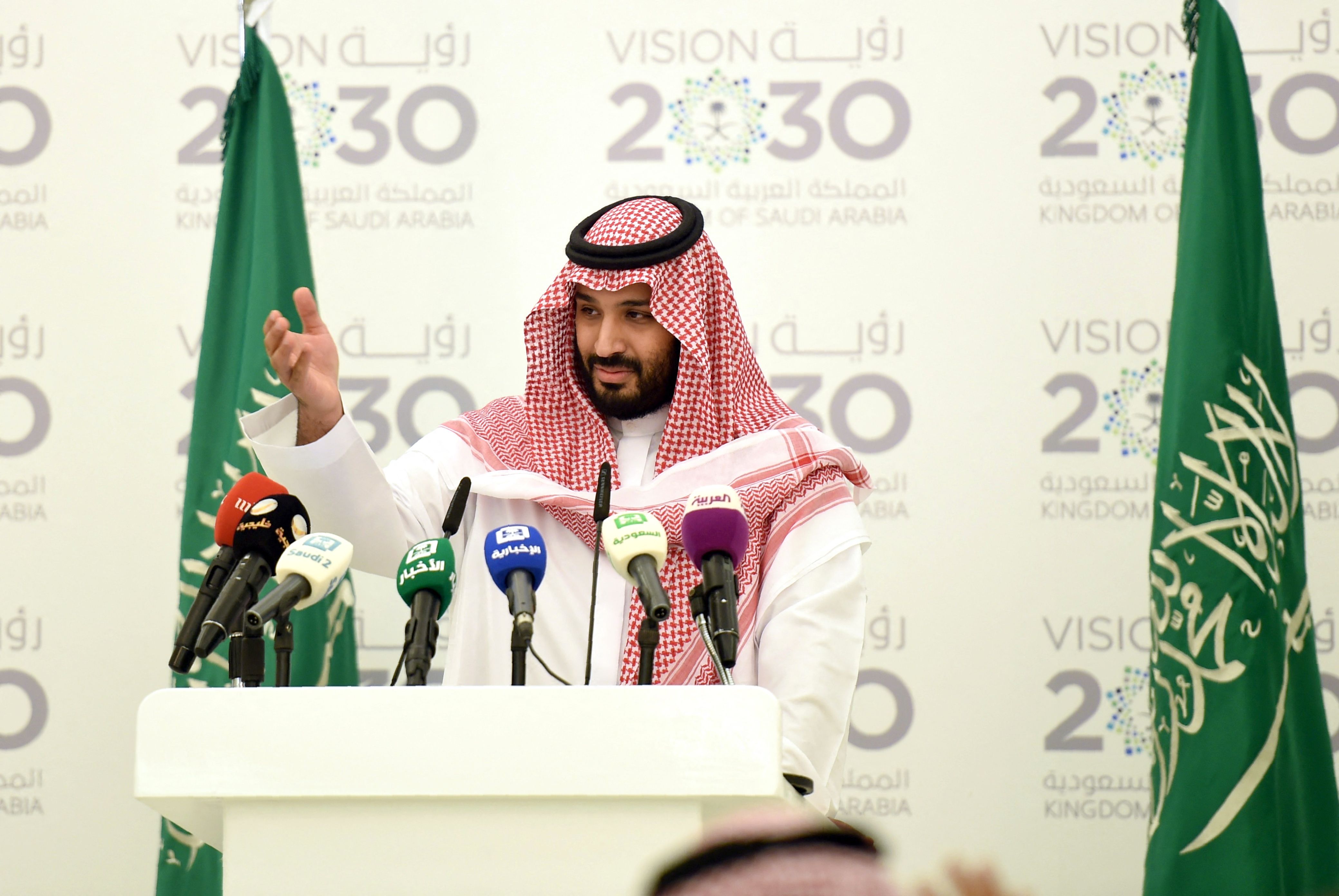 Saudi Defense Minister and Deputy Crown Prince Mohammed bin Salman gestures during a press conference in Riyadh, on April 25, 2016. The key figure behind the unveiling of a vast plan to restructure the kingdom's oil-dependent economy, the son of King Salman has risen to among Saudi Arabia's most influential figures since being named second-in-line to the throne in 2015. Salman announced his economic reform plan known as 