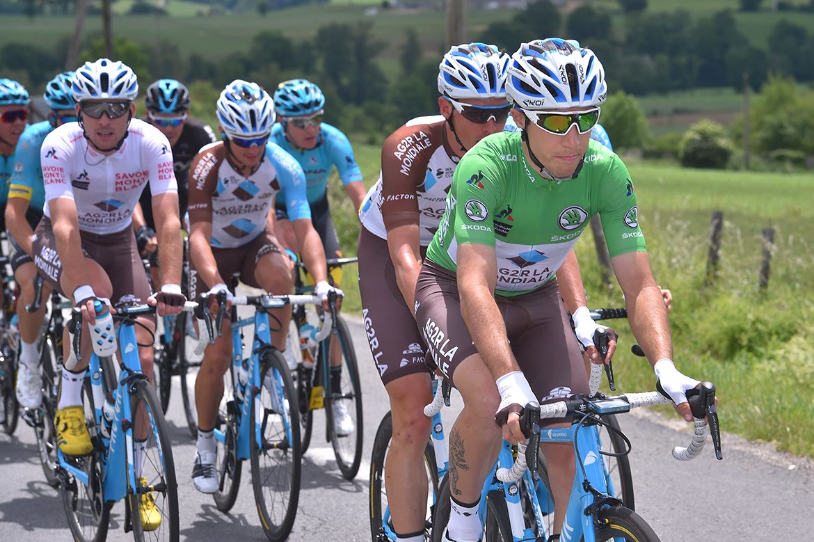Axel Domont wears the green jersey