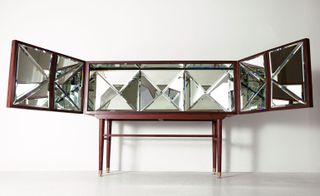 The iterations include 'Kaleidescope', a mirror-panelled piece that multiplies the contents.