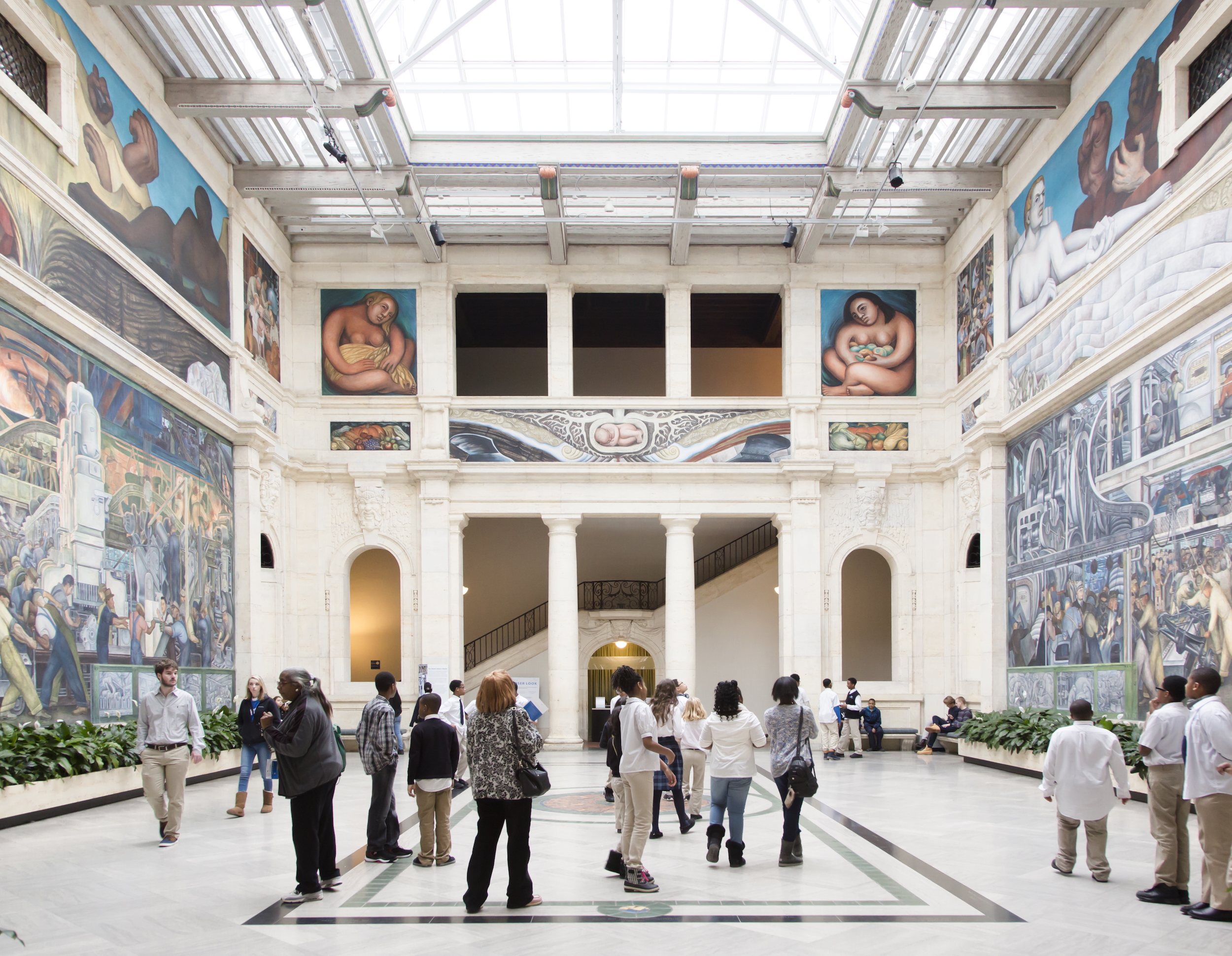 Visitors mingle in the Rivera Court at Detroit Institute of Arts