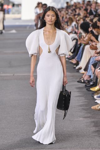 a runway model walks the Chloé spring 2024 runway