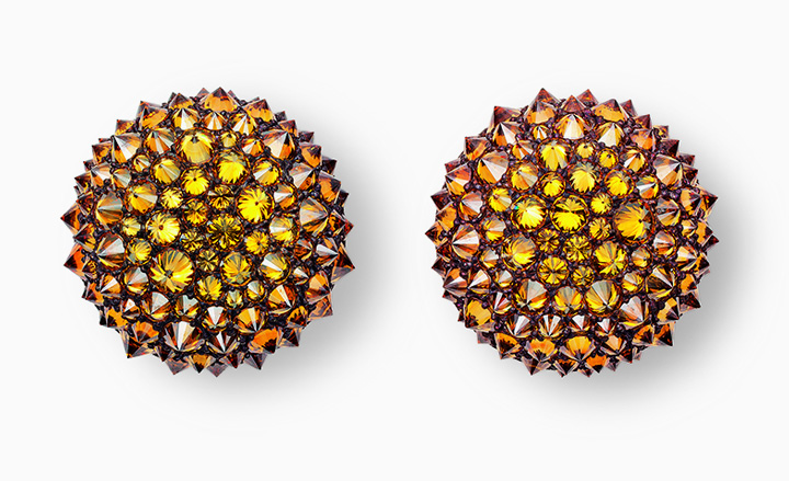 These white-gold and copper earrings are 'upside down