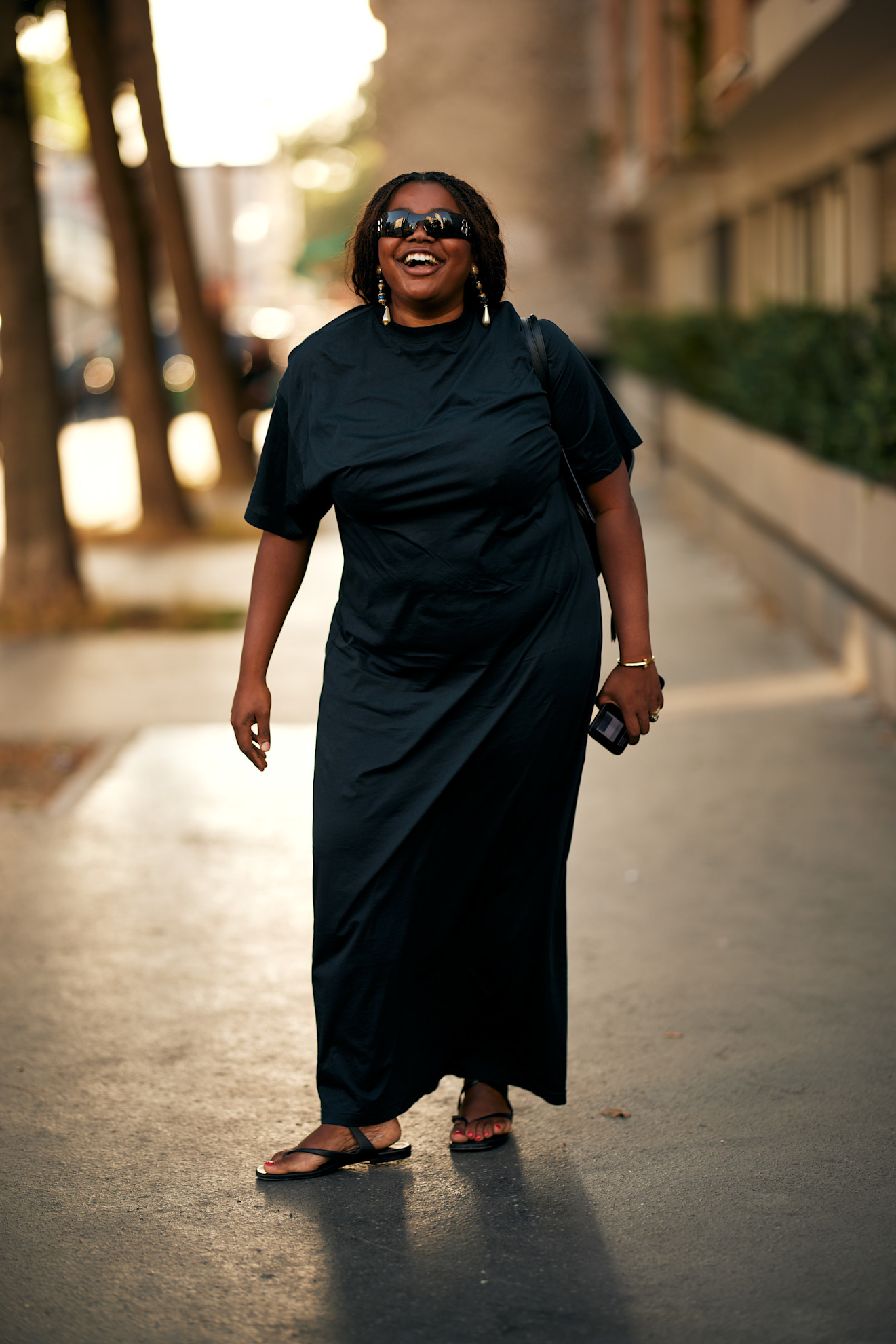 fashion week attendee wearing black dress and sandals