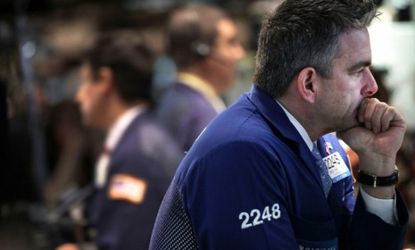 Traders on the New York Stock Exchange: The Dow Jones Industrial Average reached 13,000 points on Tuesday for the first time since the 2008 financial crisis.