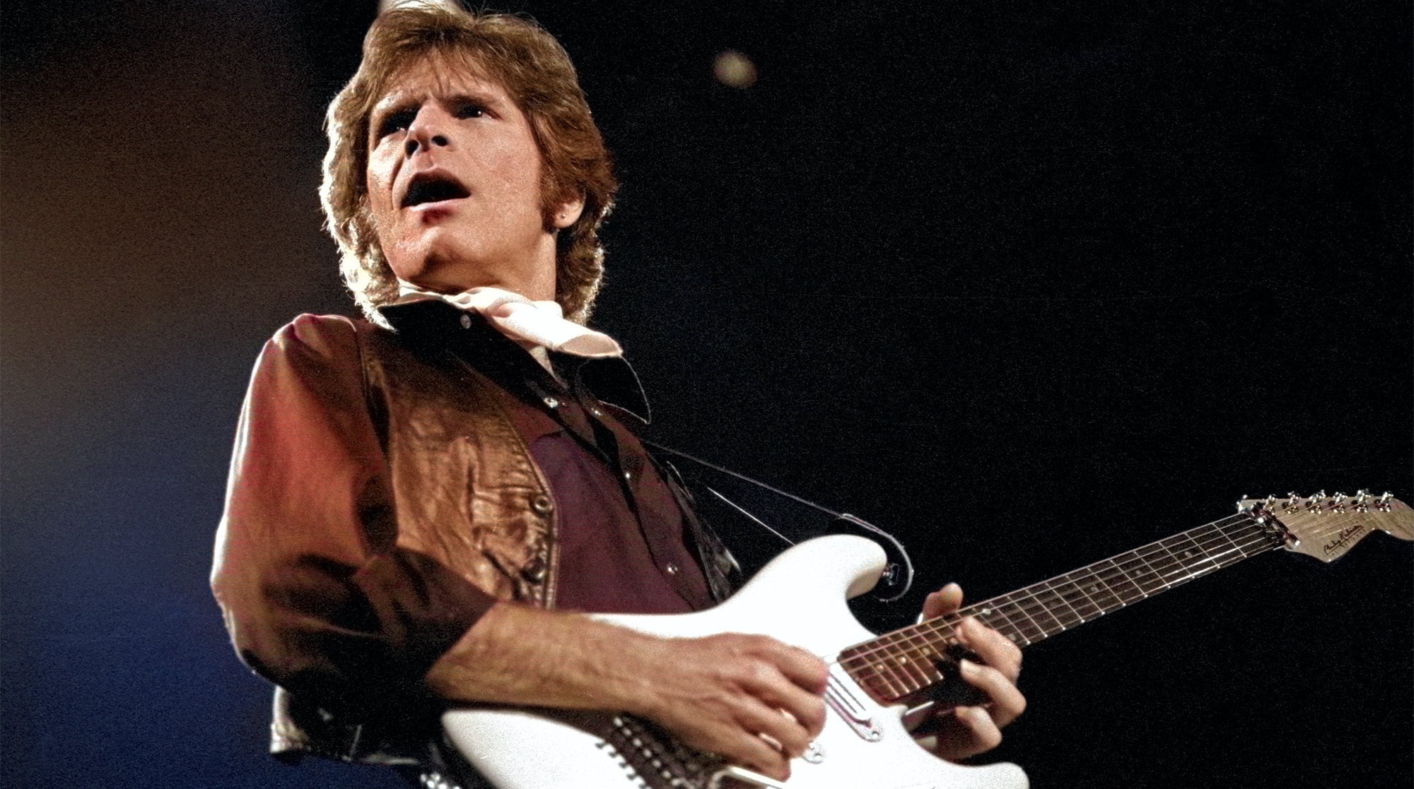 John Fogerty performs at the Oakland Coliseum on December 7, 1986.