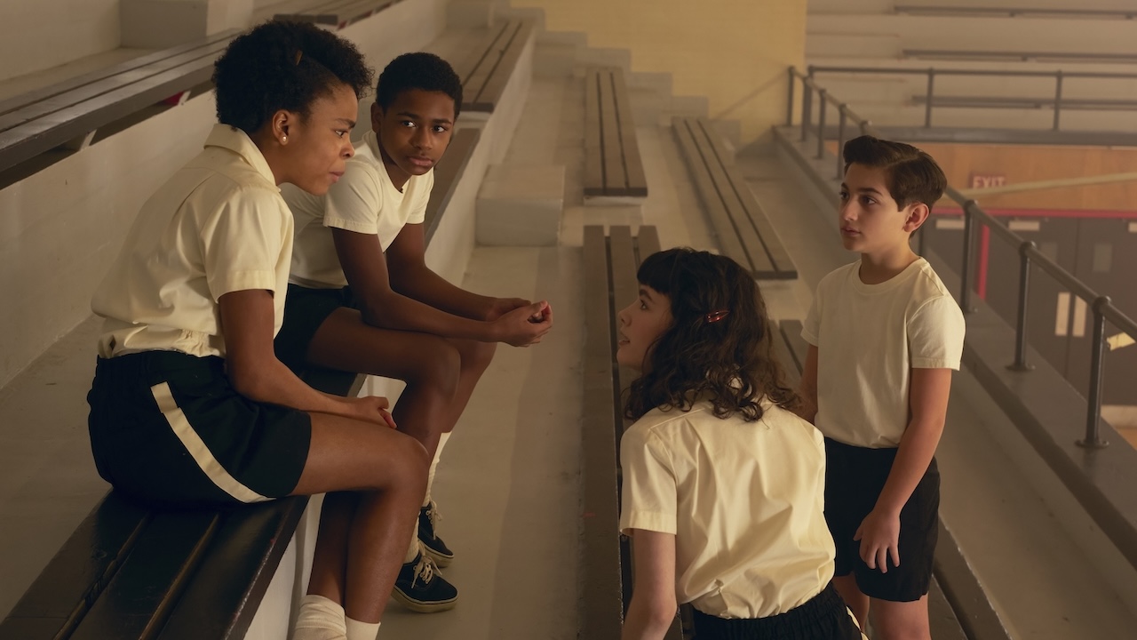 Will, Ronnie, Rich and Lilly talking in the gym bleachers in IT: Welcome to Derry Episode 4