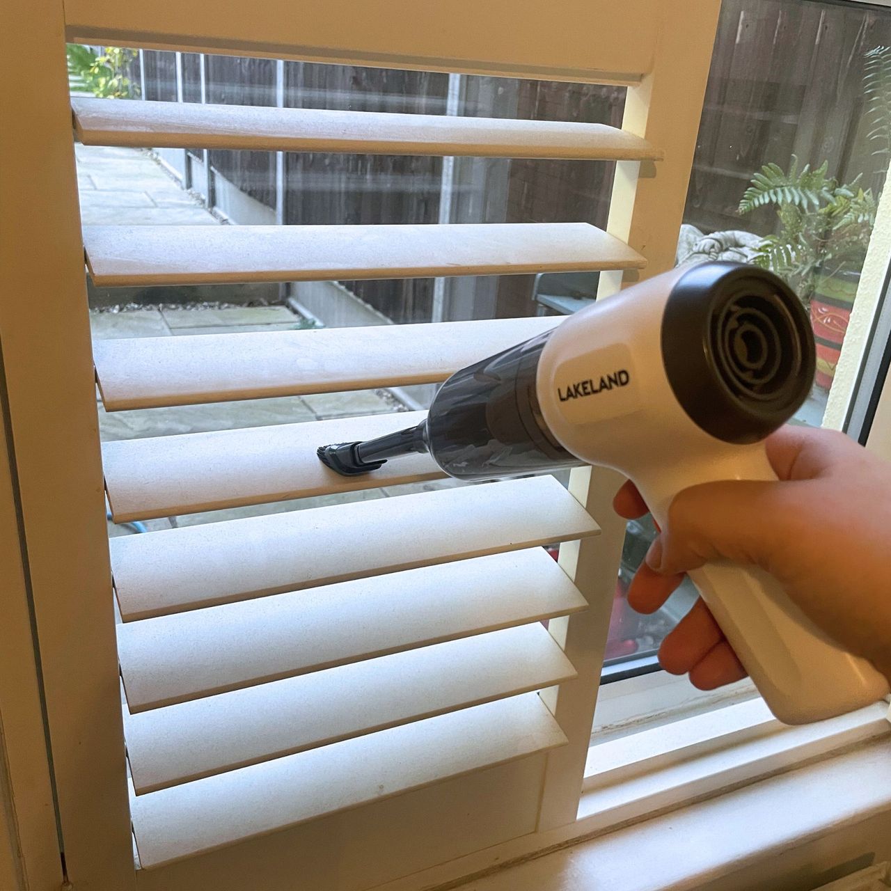 Using eth Lakeland 3-in-1 Mini Vacuum Cleaner to dust plantation shutter blinds