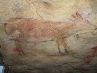 Painted deer decorate Altamira Cave in Spain.