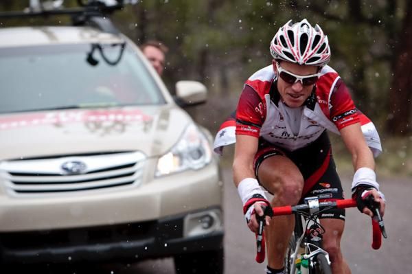 Darren Lill (Fly V Australia) gets encouragement from the team car as he soloes to the win.