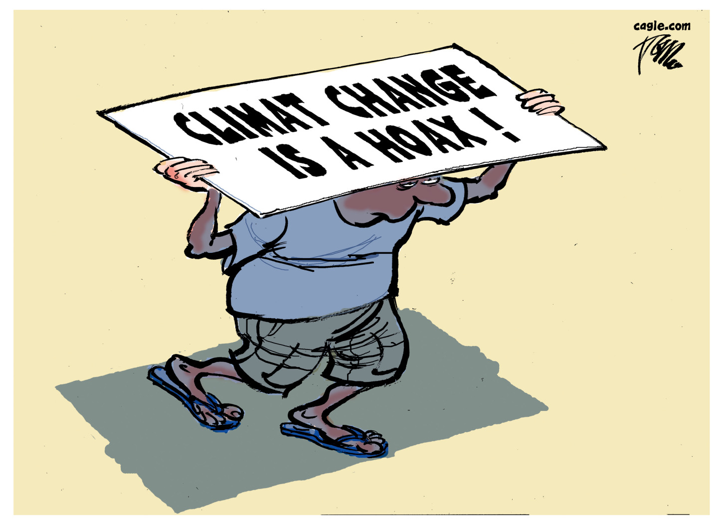 A man tries to shade himself from the sun with a misspelled sign that reads, &amp;ldquo;Climat change is a hoax!&amp;rdquo;